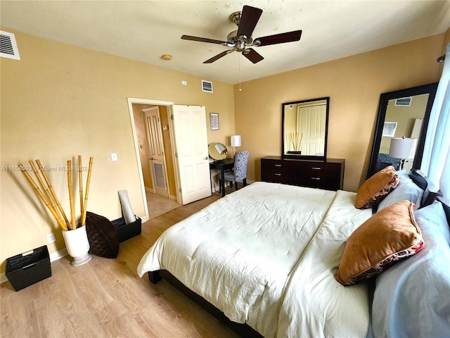 bedroom featuring light hardwood / wood-style floors and ceiling fan