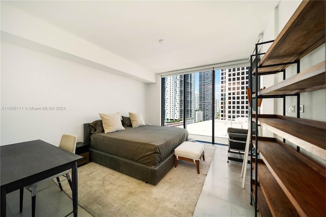 bedroom with access to outside and floor to ceiling windows