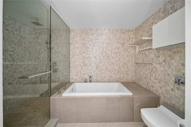 bathroom featuring separate shower and tub, tile walls, toilet, and tile patterned floors