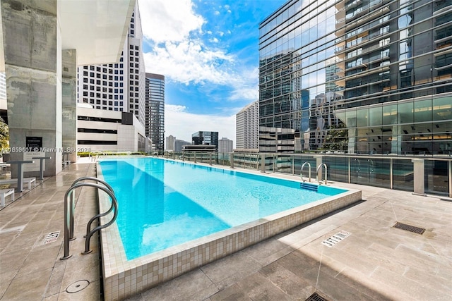 view of swimming pool featuring a patio area