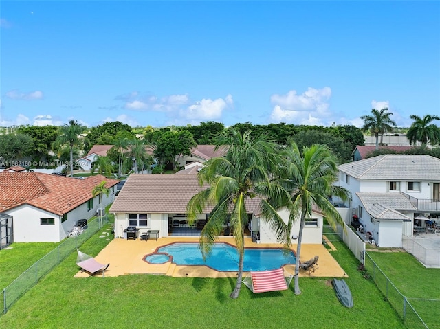 view of swimming pool featuring a lawn and a patio