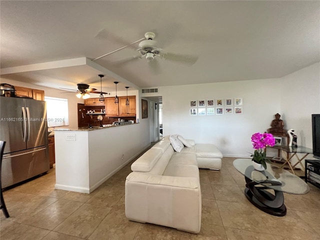 living room with light tile patterned flooring and ceiling fan