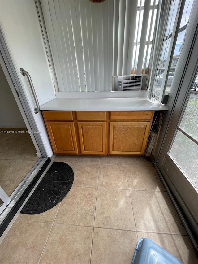 interior space with cooling unit and tile patterned flooring