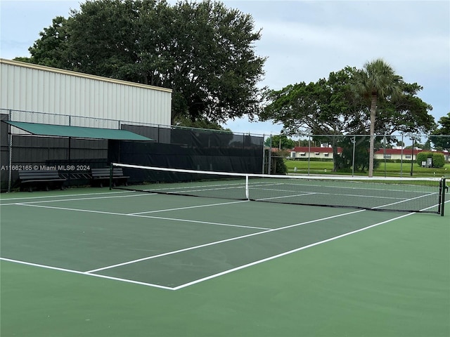 view of sport court with basketball hoop