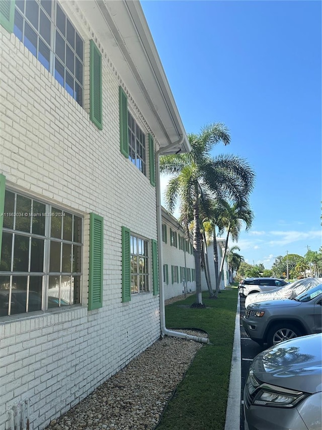 view of home's exterior with a lawn