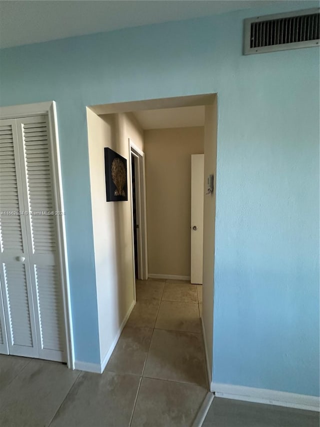 hall featuring tile patterned floors