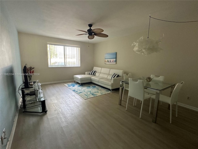 living room with ceiling fan and hardwood / wood-style floors