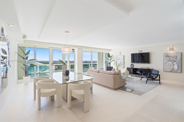 dining space with a water view