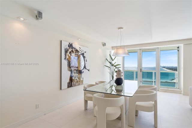 dining room with a water view