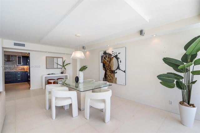 dining area featuring light tile patterned floors