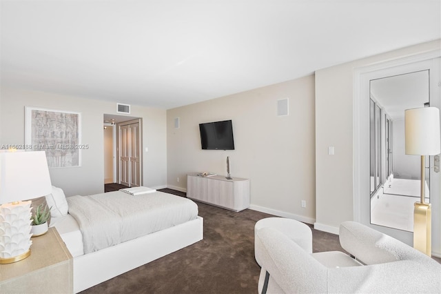 bedroom featuring dark carpet