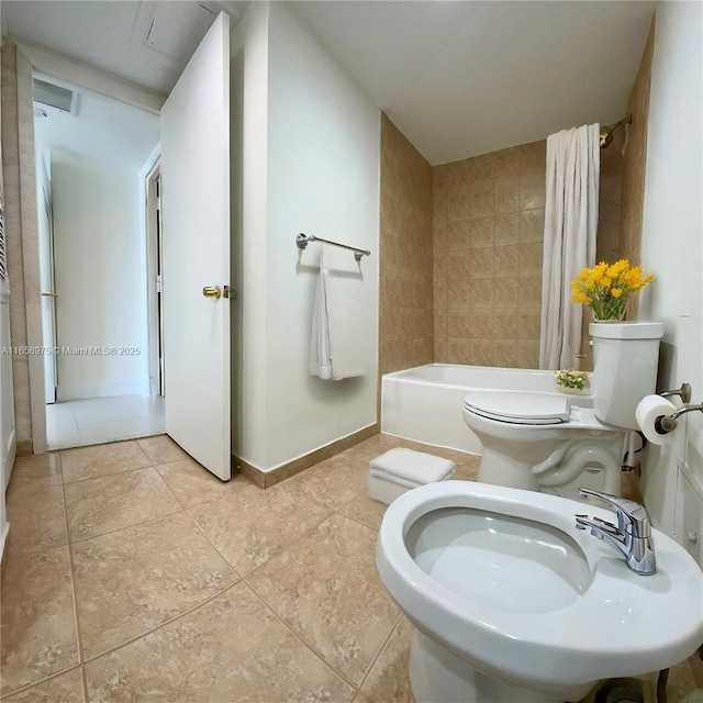 bathroom with shower / bath combo, tile patterned floors, and toilet