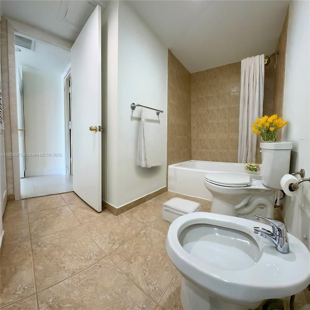 5600 Collins Ave Unit 15B, Miami Beach, FL 33140 - full bath with a bidet, tile patterned floors, and shower / tub combo