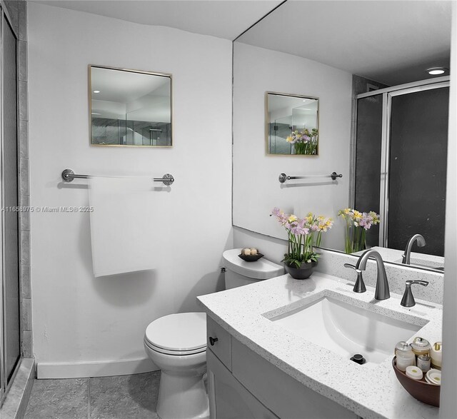 5600 Collins Ave Unit 15B, Miami Beach, FL 33140 - bathroom featuring a shower stall, vanity, and tile patterned flooring