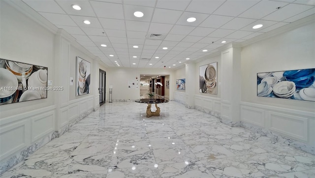 5600 Collins Ave Unit 15B, Miami Beach, FL 33140 - corridor featuring a decorative wall, recessed lighting, and wainscoting