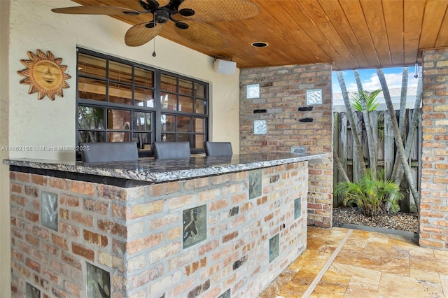 view of patio featuring ceiling fan and an outdoor kitchen