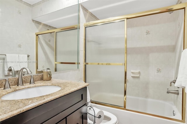 bathroom with vanity and bath / shower combo with glass door