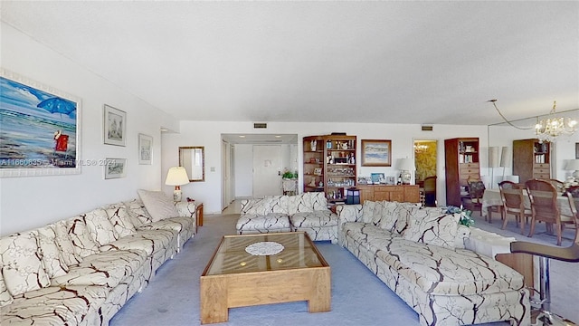 living room with a notable chandelier and light carpet