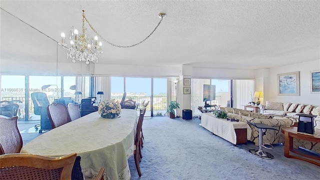 dining area with a textured ceiling, a notable chandelier, a wealth of natural light, and carpet flooring