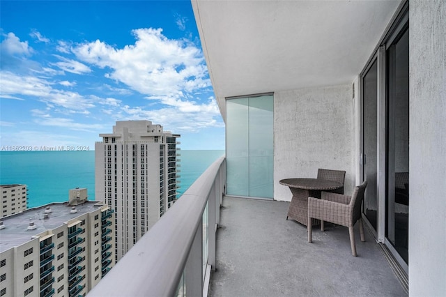 balcony featuring a water view