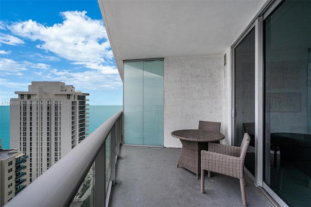 balcony featuring a water view