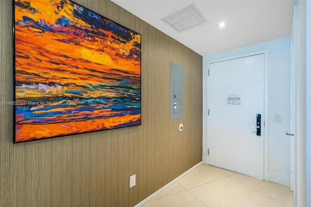 entryway with electric panel and light tile patterned floors