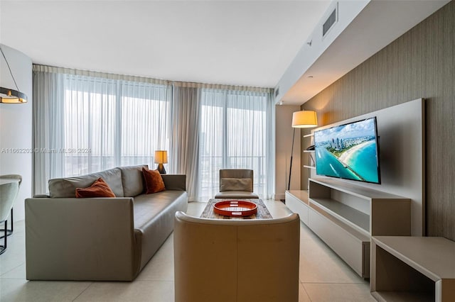 tiled living room featuring a healthy amount of sunlight