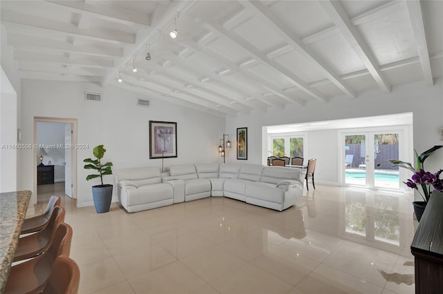 tiled living room with vaulted ceiling with beams, french doors, and rail lighting