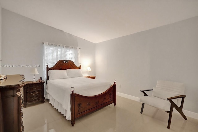 bedroom with lofted ceiling