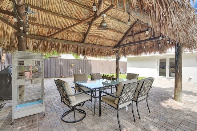 view of patio / terrace with a gazebo, ceiling fan, and french doors