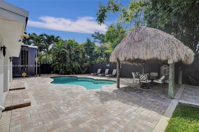 view of swimming pool featuring a patio area and a gazebo