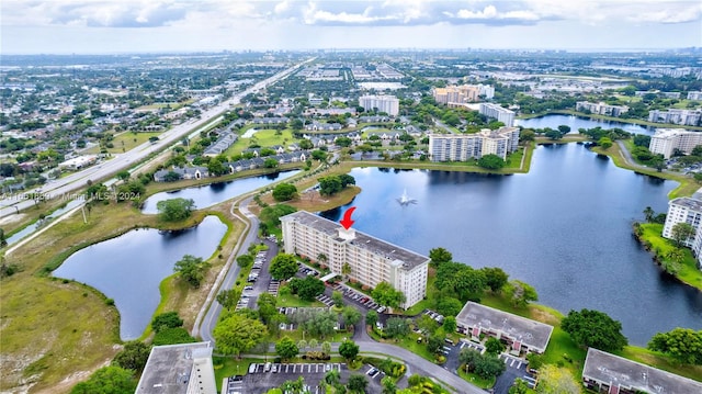 drone / aerial view with a water view