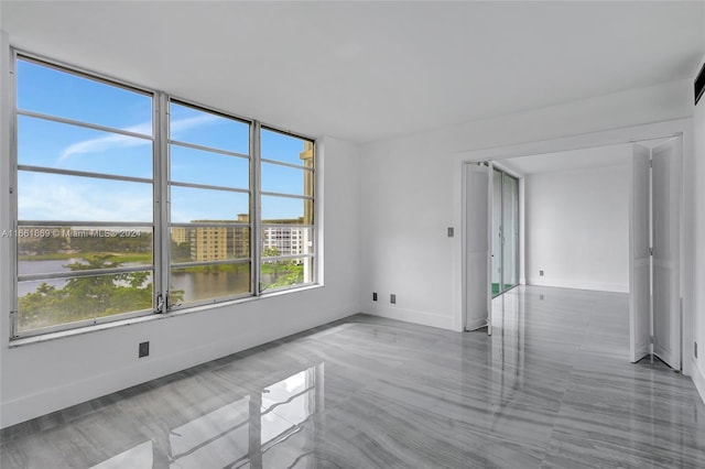 empty room featuring a water view