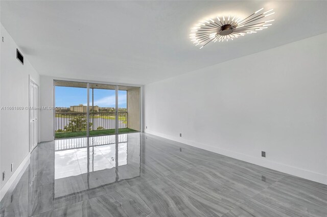 empty room featuring expansive windows