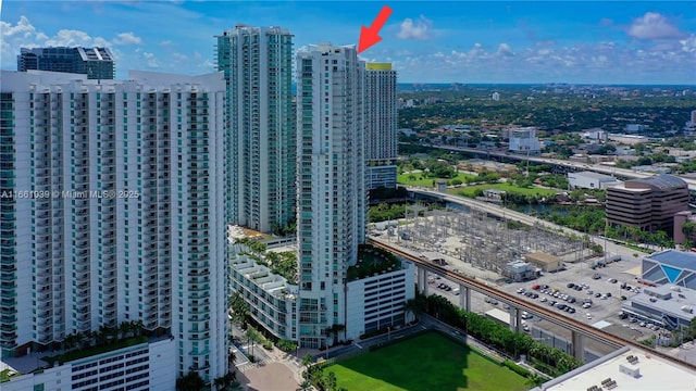 birds eye view of property featuring a city view