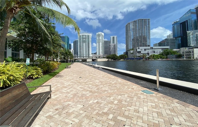 view of home's community featuring a city view and a water view