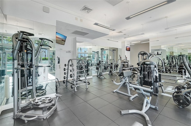 exercise room featuring a wealth of natural light and visible vents