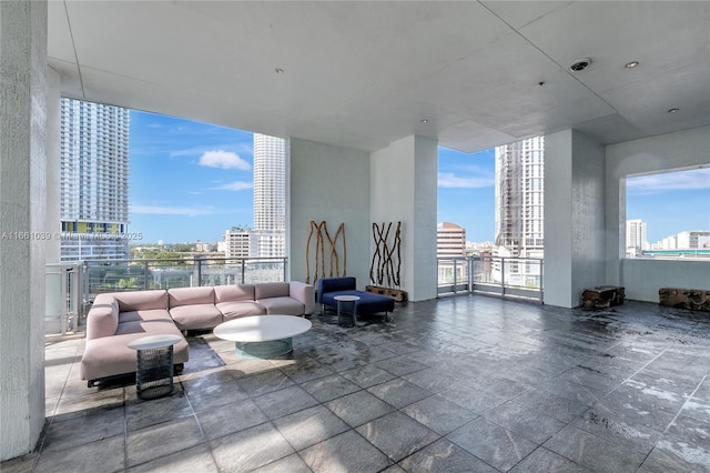 view of patio featuring a balcony and a city view