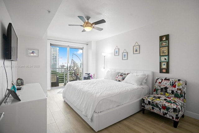 bedroom featuring access to outside, ceiling fan, and light hardwood / wood-style floors