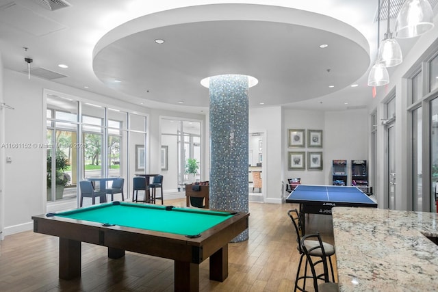 game room with billiards and light hardwood / wood-style flooring