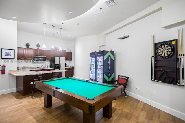 recreation room with light hardwood / wood-style floors and billiards