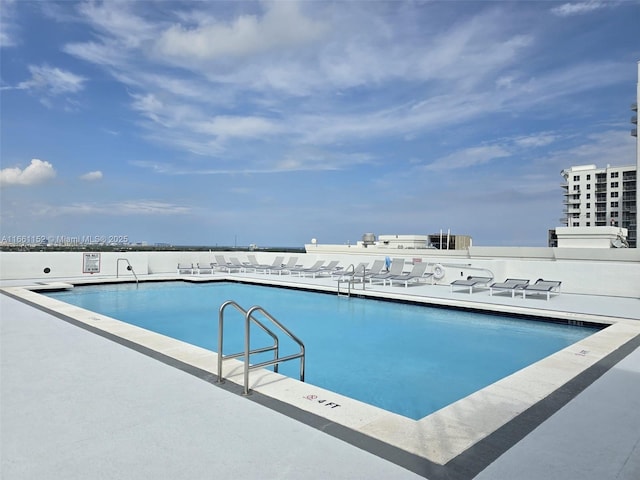 view of swimming pool with a patio area