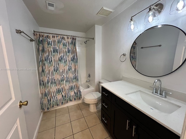 full bathroom with vanity, shower / bath combo with shower curtain, toilet, and tile patterned floors