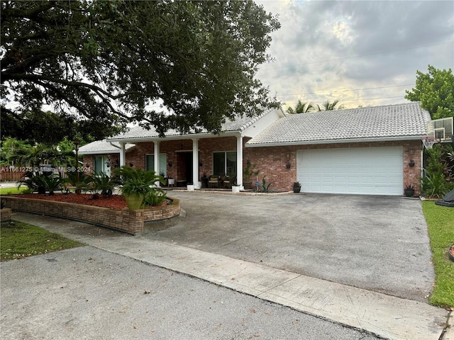 ranch-style home featuring a garage