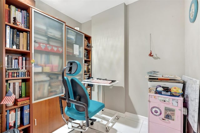 office space with light tile patterned floors