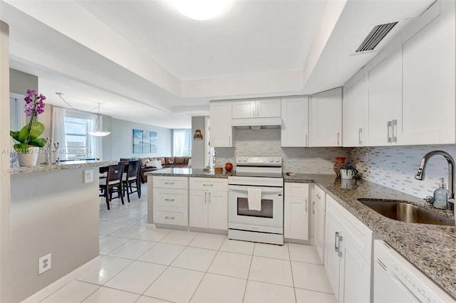 kitchen featuring white appliances, decorative light fixtures, white cabinetry, and sink