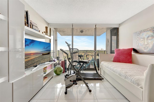 interior space featuring floor to ceiling windows and a textured ceiling