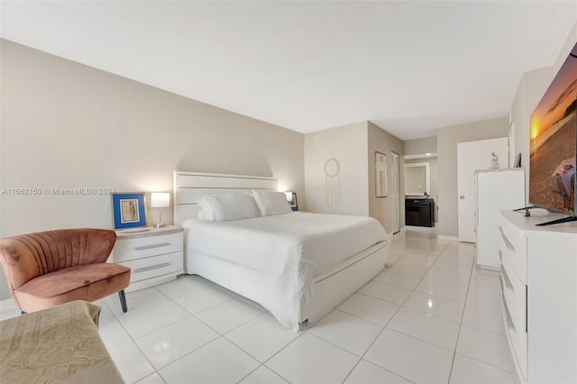 bedroom featuring light tile patterned flooring