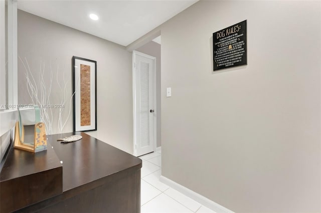 hallway featuring light tile patterned floors