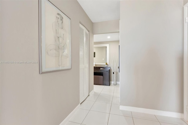 corridor with light tile patterned flooring